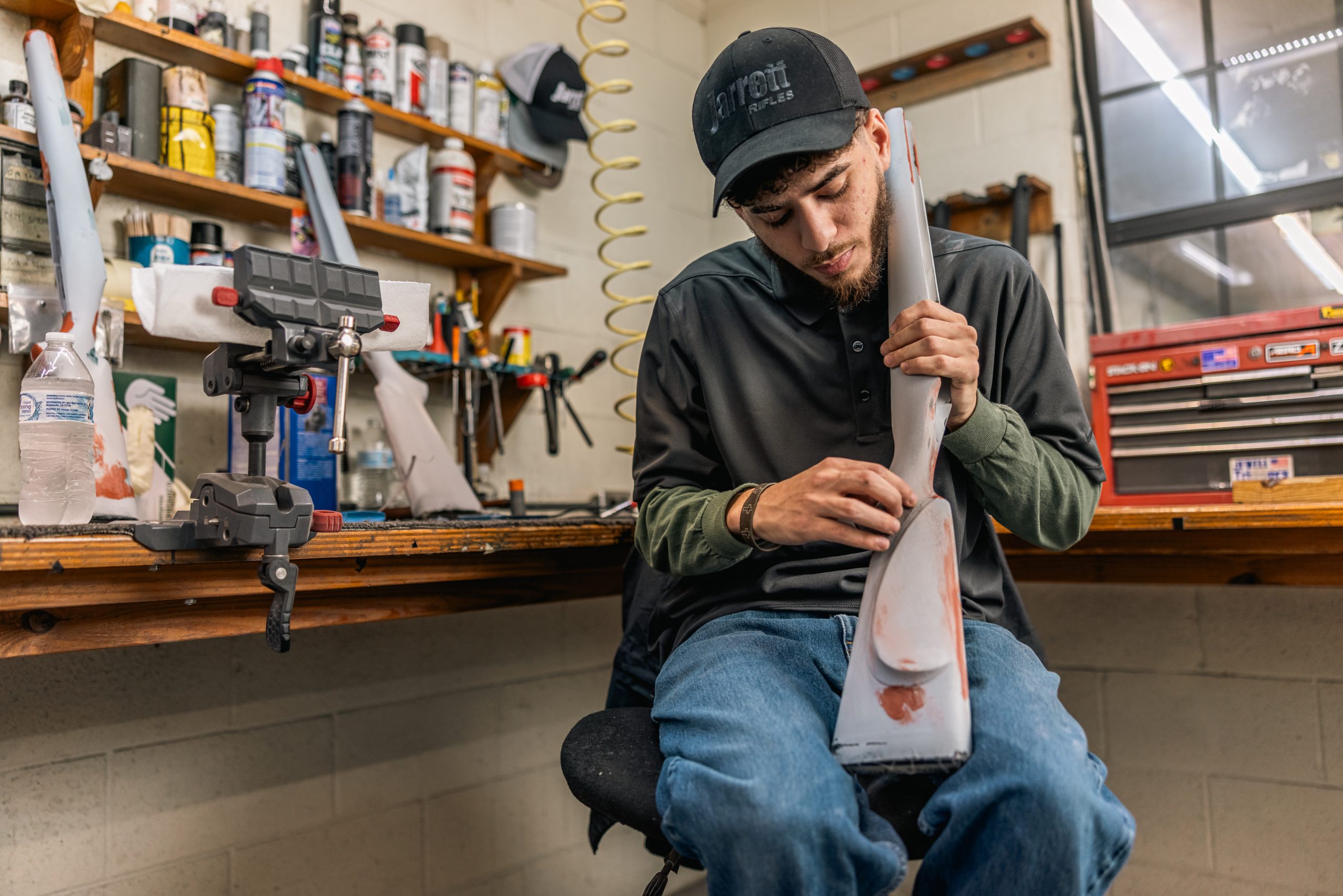 Jarrett Rifles technician shaping a rifle stock